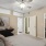 Primary bedroom with carpet and ceiling fan