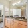 bathroom with storage and large mirror