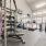 Large fitness center with large windows and plenty of equipment
